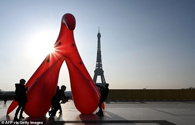 The Clito Gang set up the five metre sexual organ in view of the Eiffel Tower to draw attention to widespread 'sexual illiteracy'